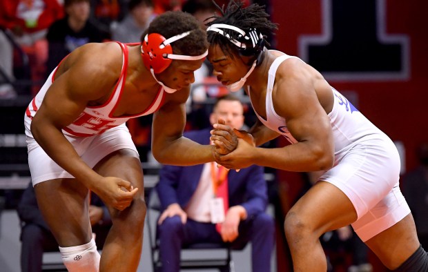 Warren's Aaron Stewart and Homewood Flossmoor's RJ Robinson jockey for position in the 175 pound Class 3A 1st place bout in the IHSA Wrestling individual state meet at the University of Illinois' State Farm Arena in Champaign, Saturday Feb. 22, 2025. (Rob Dicker / for the News Sun)