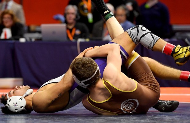 Mt. Carmel's Seth Mendoza gets very close to pinning Hononegah's Thomas Silva in the 138 pound Class 3A1st place bout at the IHSA Wrestling individual state meet at the University of Illinois' State Farm Arena in Champaign, Saturday Feb. 22, 2025. (Rob Dicker / for the Daily Southtown)