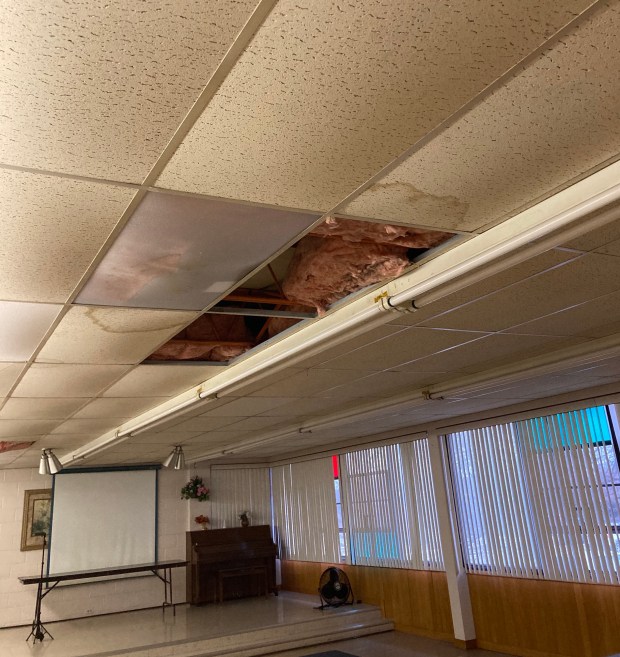 A leaky roof has damaged some of the ceiling tiles and insulation in the fellowship hall at Hometown Christian Church. (Melinda Moore/Daily Southtown)