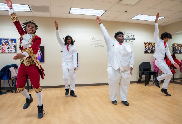 Junior Trevor Branch, from left, junior Jadyn Erves, senior Jeremiah Smith and junior Gavin White from Southland College Prep Charter High School practice stepping, a form of percussive dance in African American culture, for the Kappa League Step Show on Feb. 15 in Richton Park. (Eric Lites)