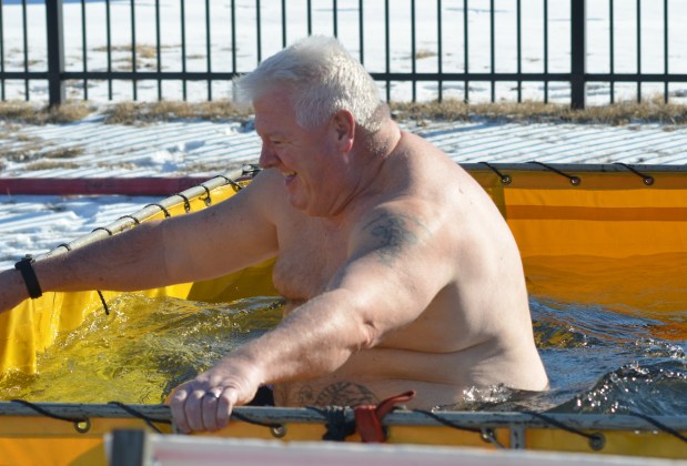 Tinley Park police Officer Dennis Reilly, a veteran of hundreds of plunges, gets wet and cold Feb. 22, 2025, for Special Olympics. (Jeff Vorva/for the Daily Southtown)