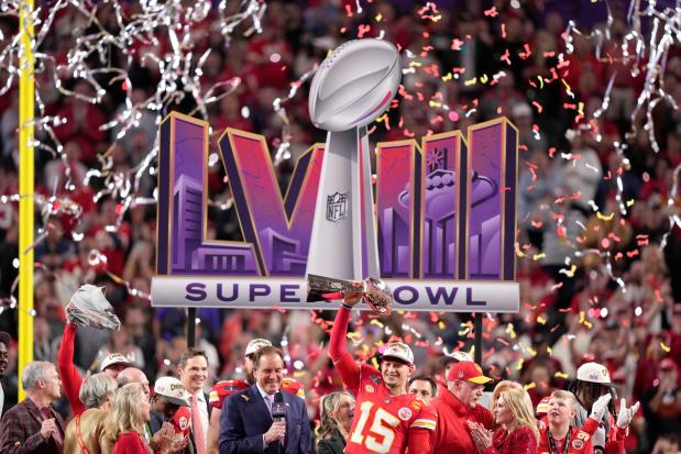 FILE - Kansas City Chiefs quarterback Patrick Mahomes raises the Lombardi Trophy over his head after defeating the San Francisco 49ers in NFL Super Bowl 58 football game Sunday, Feb. 11, 2024, in Las Vegas. (AP Photo/Doug Benc, File0