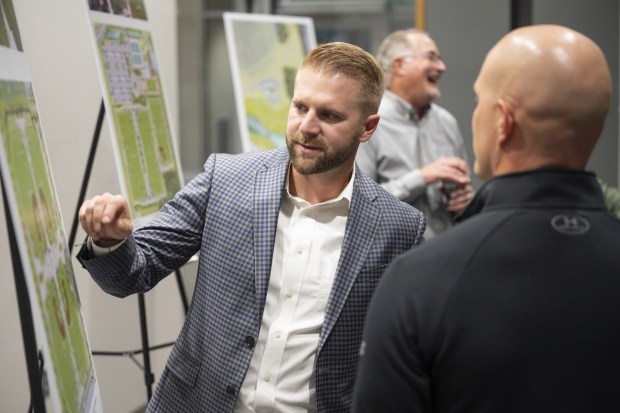 Assistant Director of Valparaiso Parks Kevin Nuppnau, points out features on a diagram of the Valparaiso Sports and Recreation Center for visitors during an open house on Wednesday, October 12, 2022. (Kyle Telechan for the Post-Tribune)