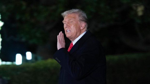 President Donald Trump arrives on the South Lawn of the White House, in Washington, Monday, Feb. 10, 2025. (AP Photo/Jose Luis Magana)