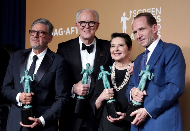 Sergio Castellitto, from left, John Lithgow, Isabella Rossellini, and Ralph Fiennes, winners of the award for outstanding performance by a cast in a motion picture for "Conclave," pose in the press room during the 31st annual Screen Actors Guild Awards on Sunday, Feb. 23, 2025, at the Shrine Auditorium in Los Angeles. (Photo by Jordan Strauss/Invision/AP)