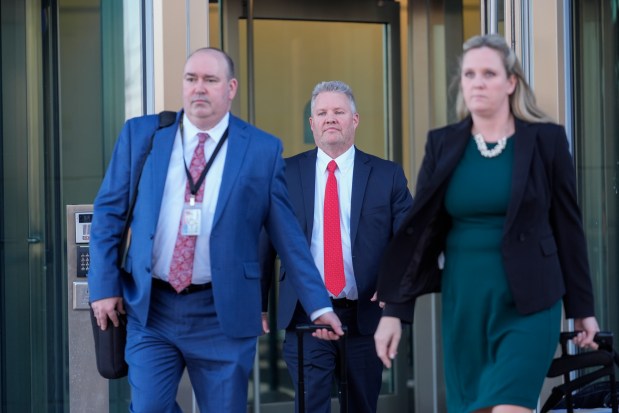 From left, Will County State's attorneys Christopher Koch, Michael Fitzgerald and Christine Vukmir leave the Will County Courhouse after the first day of the trial of Joseph Czuba, 73, who is charged with the fatal stabbing of six-year-old Palestinian boy Wadee Alfayoumiand and the wounding of his mother Hanan Shaheen on Feb. 25, 2025, in Joliet. (Erin Hooley/AP)