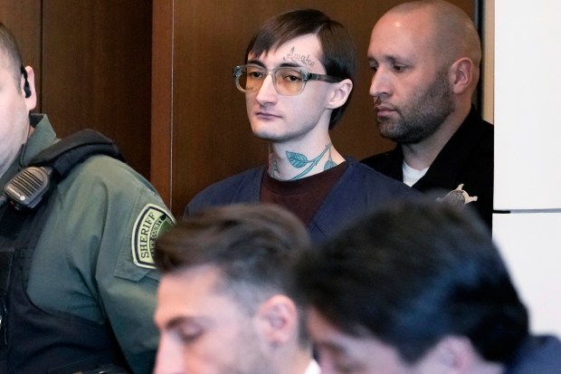 Robert Crimo III, center, arrives before Judge Victoria Rossetti during a pretrial hearing at the Lake County Courthouse in Waukegan, Feb. 20, 2025. (Nam Y. Huh/AP)