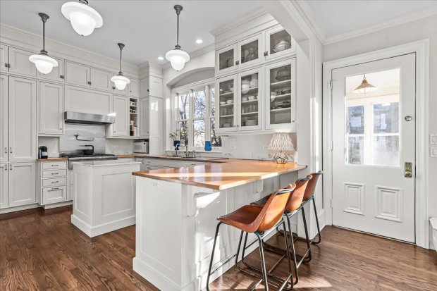 This four-bedroom home at 1326 Asbury Ave., Evanston, has a three-car heated garage as well as a darkroom in the basement. (Philip Goldman/Summit Imaging)