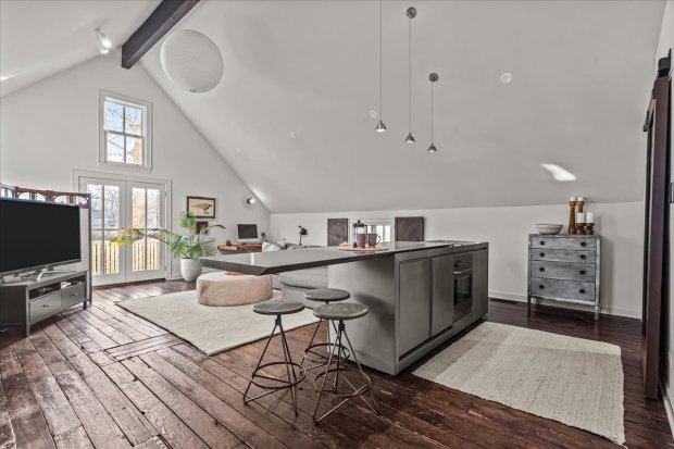 This four-bedroom home at 1326 Asbury Ave., Evanston, has a three-car heated garage as well as a darkroom in the basement. (Philip Goldman/Summit Imaging)