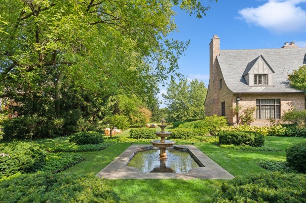 This seven-bedroom home at 35 Indian Hill Road in Winnetka has a fountain, a swimming pool and a spring-fed lake. (Joe Compean/VHT)