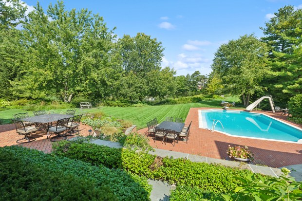 This seven-bedroom home at 35 Indian Hill Road in Winnetka has a fountain, a swimming pool and a spring-fed lake. (Joe Compean/VHT)