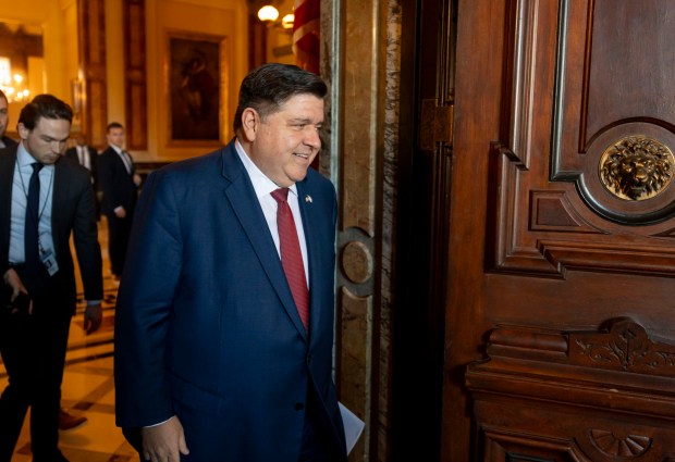 Gov. JB Pritzker arrives to speak with reporters from his ceremonial office on Jan. 8, 2025, at the Illinois State Capitol in Springfield. (Brian Cassella/Chicago Tribune)