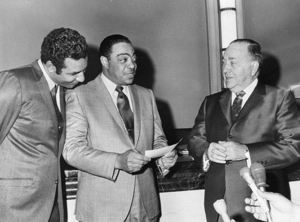 Mayor Richard J. Daley, right, in 1969 with George E. Johnson, center, of Johnson Products, and businessman and banker Alvin Boutte. (Chicago Tribune archive)