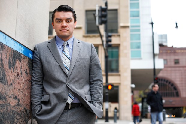 Dario Castaneda, an immigration attorney, stands outside of the U.S. Citizenship and Immigration Services field office in Chicago on May 9, 2017. (José M. Osorio/Chicago Tribune)