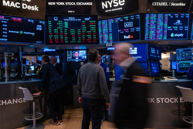 Traders work on the floor at the New York Stock Exchange on Feb. 10, 2025, in New York City. The NYSE announced that it will reincorporate its Chicago arm in North Texas. (Spencer Platt/Getty)