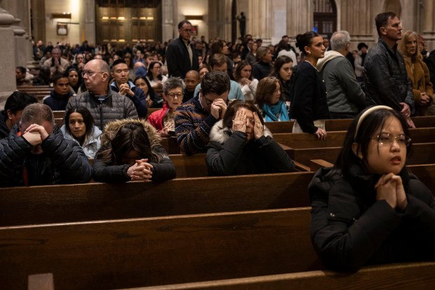 Churchgoers attend mass at St. Patrick's Cathedral in Midtown Manhattan, a day after the Vatican announced that Pope Francis was in critical condition on Feb. 23, 2025. Francis, 88, was hospitalized on Feb. 14 with a respiratory tract infection that developed into pneumonia in both lungs. (Dave Sanders/The New York Times)