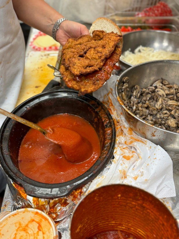 Breaded veal cutlets get smothered in tomato sauce at California Sandwiches, which has several locations in Toronto. (Lori Rackl)