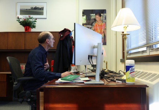 Prof. Peter Goldsmith, director and principal investigator of the Soybean Innovation Lab, responds to emails in his office at the lab on the University of Illinois campus Feb. 14, 2025, in Urbana. (John J. Kim/Chicago Tribune)