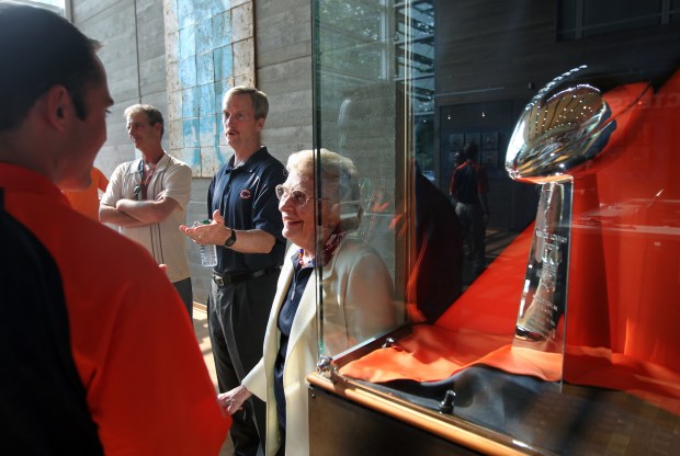 Chicago Bears Chairman of the Board George McCaskey and his mother, Bears owner Virginia McCaskey, stand beside the team's Lombardi Trophy from Super Bowl XX in 1986 while meeting with Bears season ticket holders at Halas Hall in Lake Forest on June 8, 2011. (Chris Sweda/Chicago Tribune)