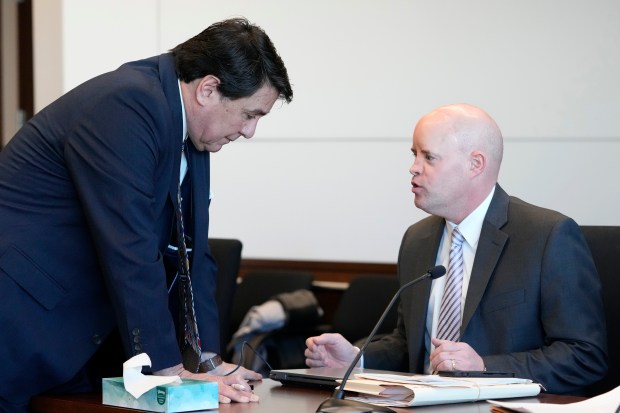 Robert E. Crimo III's attorney Gregory Ticsay, left, talks to Lake County Assistant State's Attorney Ben Dillon, before a pretrial hearing for Robert E. Crimo, III., at the Lake County Courthouse in Waukegan, Ill., Thursday, Feb. 20, 2025. (AP Photo/Nam Y. Huh, Pool)