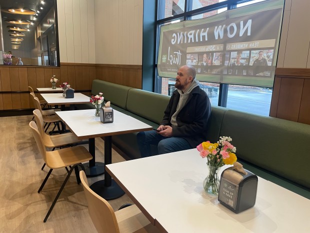 Bradford Garrison, an information technology specialist for The Fresh Market, takes a break in the seating area in the company's new Northbrook store. (Phil Rockrohr/for the Pioneer Press)