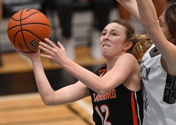 Lincoln-Way West's Taylor Gugliuzza (12) goes up to the basket during a game against Fenwick on Monday, Jan. 20, 2020.