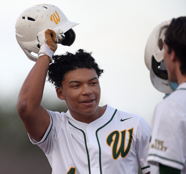 Waubonsie Valley's Joshua Hung (4) celebrates his sixth inning home run with Ryan Lucas (7) during a non conference game against Marmion in Aurora on March 18, 2025.H. Rick Bamman/for the Beacon-News