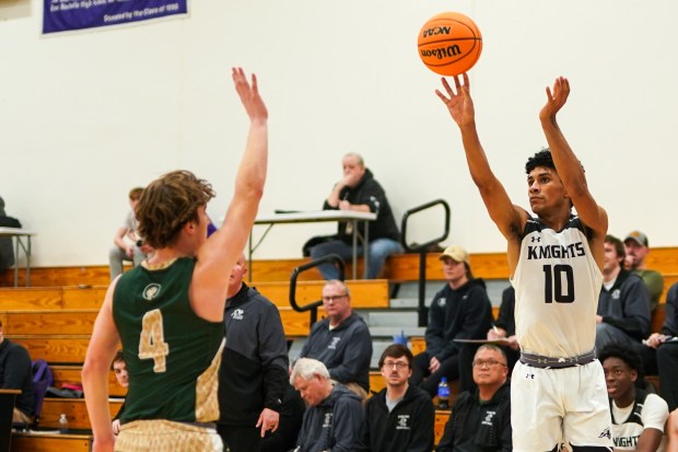 Kaneland's Jalen Carter (10) shoots a 3-pointer against Boylan Catholic's Caleb Nelson (4) during a Class 3A Rochelle Sectional semifinal basketball game at Rochelle High School on Wednesday, March 5, 2025. (Sean King / for The Beacon-News)