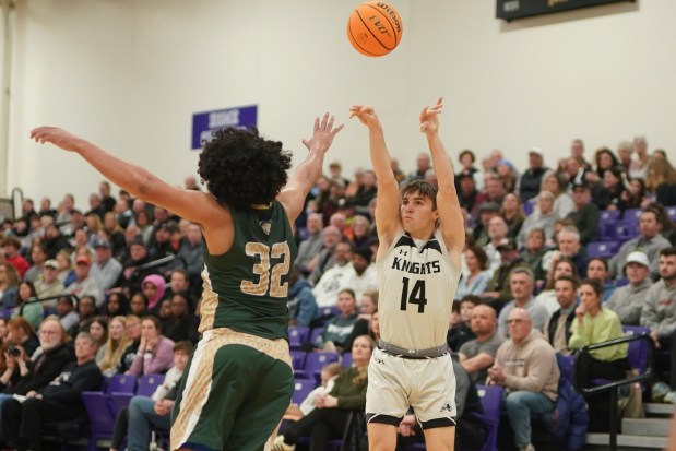 Kaneland's Preston Popovich (14) shoots a 3-pointer against Boylan Catholic's Christian Kennedy (32) during a Class 3A Rochelle Sectional semifinal basketball game at Rochelle High School on Wednesday, March 5, 2025. (Sean King / for The Beacon-News)