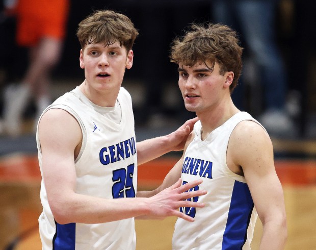 Geneva's Hudson Kirby (25) and Jack Hatton (20) react to the win over Wheaton-Warrenville South during a Class 4A St. Charles East Sectional semifinal in St. Charles on Wednesday, March 5, 2025.H. Rick Bamman / For the Beacon-News