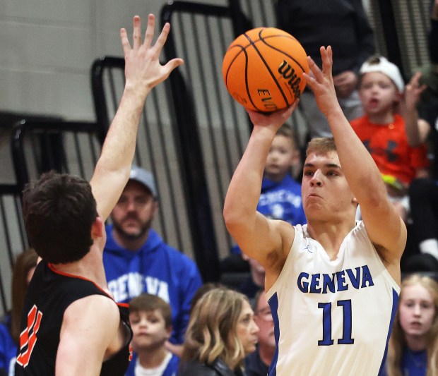 Geneva's Nelson J. Wendell (11) shoots a 3-point basket over Wheaton-Warrenville South defender Zach Rogers (11) in the second quarter during a Class 4A St. Charles East Sectional semifinal in St. Charles on Wednesday, March 5, 2025.H. Rick Bamman / For the Beacon-News