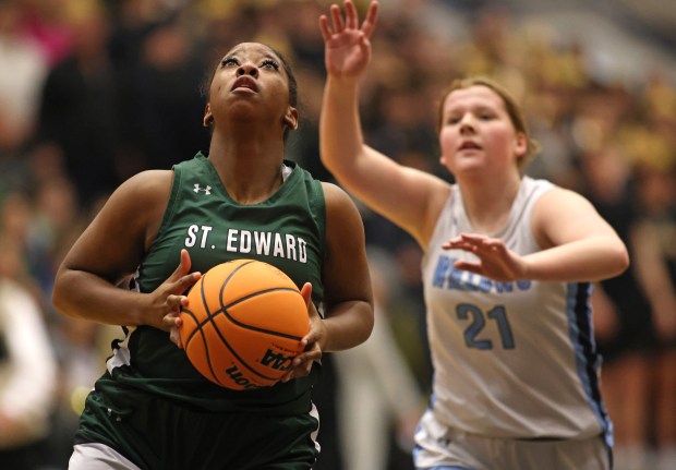 St. Edward's Jordin Sauls (30) grabs a rebound and scores in the first quarter in front of Willows Academy's Maura Crimmins (21) during the Class 1A Harvest Christian Supersectional in Elgin on Monday, March 3, 2025.H. Rick Bamman / For the Beacon-News