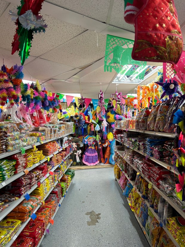 The Dulceria de Aurora sells sell candy and snacks from Mexico, stuffed animals and pinatas. Owners say things have been slower lately, with many people asking about ways to buy their products without coming to the store. (Molly Morrow / The Beacon-News)