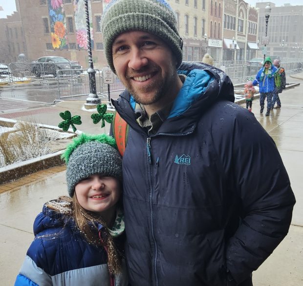 Billy Van Duzor and his daughter Nora, 8 of North Aurora, said despite the wintry weather, they were excited to be at Aurora's St. Patrick's celebration on Sunday. (David Sharos / For The Beacon-News)