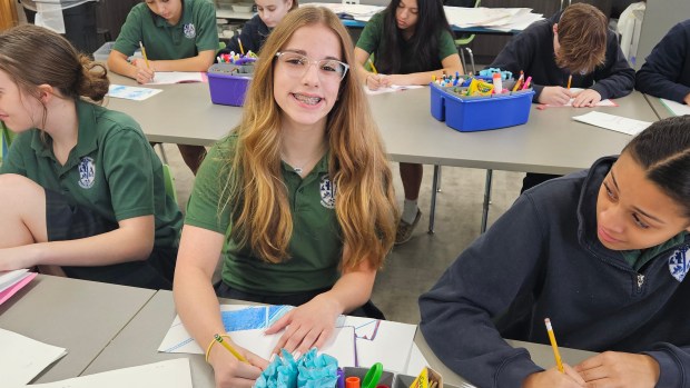 Maddy Miller, 13, of Aurora, who attends Annunciation School in Aurora, said she enjoys the art class taught by Aurora art teacher Laura Lynne. (David Sharos / For The Beacon-News)