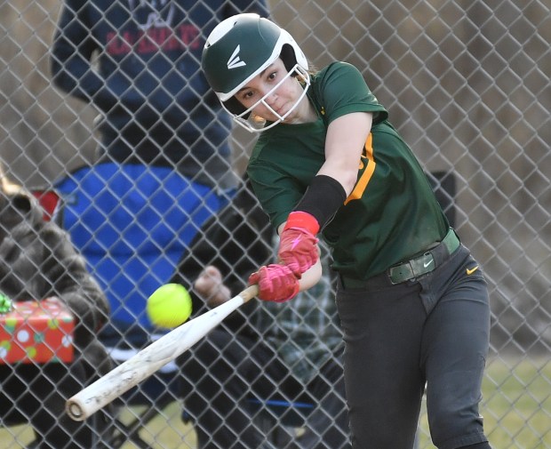 Waubonsie Valley's Addison Powell puts the bat on the ball during a game against West Aurora on Tuesday, March 18, 2025 in Aurora.(Jon Cunningham/for The Beacon-News)