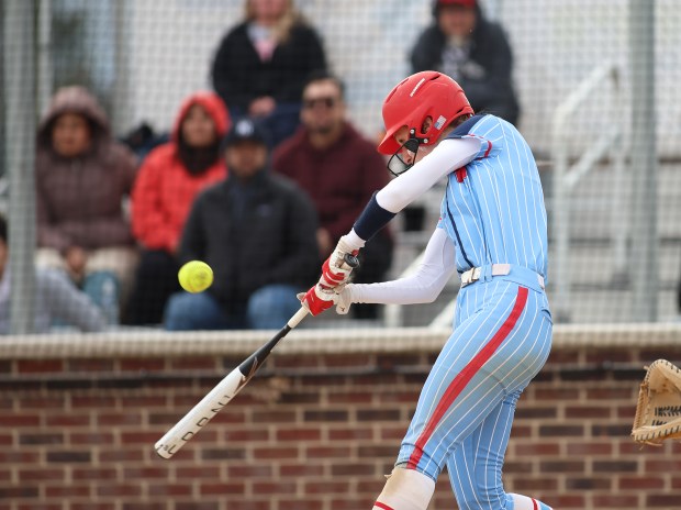 West Aurora's Sara Tarr (3) hits a home run during a softball game at Oswego High School in Aurora on Thursday, April 11, 2024. (Trent Sprague/for Chicago Tribune)