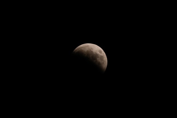 A lunar eclipse, is visible early Friday, March 14, 2025, in Chicago. (AP Photo/Kiichiro Sato)