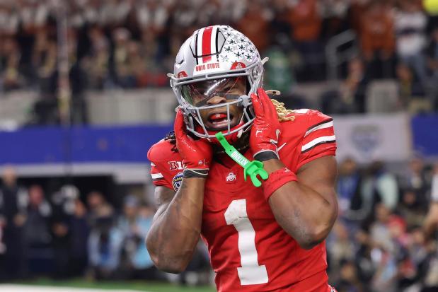 Ohio State running back Quinshon Judkins reacts after scoring a touchdown against Texas during the Cotton Bowl on Jan. 10, 2025, in Arlington, Texas. (AP Photo/Gareth Patterson)