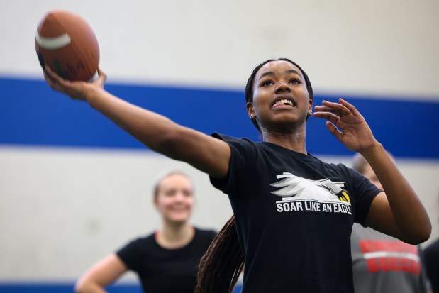 Benedictine University's Marilyn Myrick throws as her teammates run routes during a practice on Feb. 21, 2025. (Audrey Richardson/Chicago Tribune)