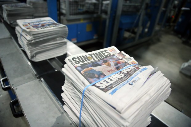 Print edition copies of the Chicago Sun-Times in 2017. About one-fifth of the news organization's staffers took a buyout in a cost-cutting initiative by Chicago Public Media. (Nuccio DiNuzzo/Chicago Tribune)