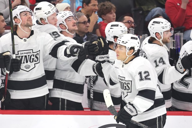 Kings' Trevor Moore high fives teammates after scoring against the Blackhawks during the first period at the United Center on March 20, 2025. (Photo by Michael Reaves/Getty Images)