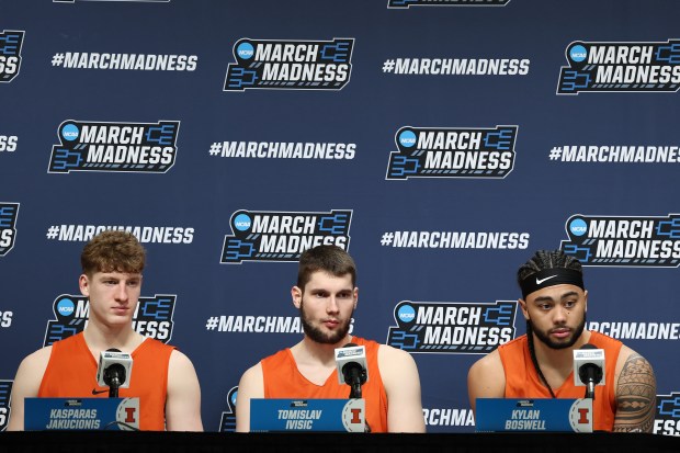 Kasparas Jakucionis #32, Tomislav Ivisic #13 and Kylan Boswell #4 of the Illinois Fighting Illini speak to the media during practice day ahead of the NCAA Men's Basketball Tournament at Fiserv Forum on March 20, 2025 in Milwaukee, Wisconsin. (Photo by Stacy Revere/Getty Images)