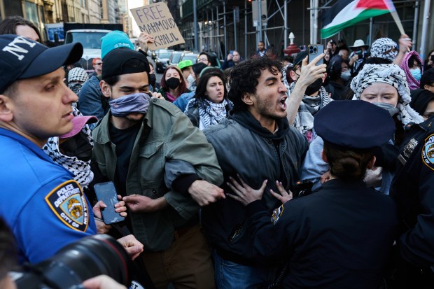 New York Police Department officers clash with demonstrators at Washington Square Park in New York on March 11, 2025, as people gather to protest the arrest of Mahmoud Khalil, a well-known activist who played a major role in Columbia University's pro-Palestinian student movement last year. (Bing Guan/The New York Times)