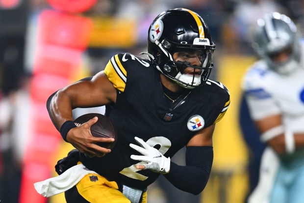 Steelers QB Justin Fields runs the ball during the first quarter against the Cowboys at Acrisure Stadium on Oct. 6, 2024. (Photo by Joe Sargent/Getty Images)