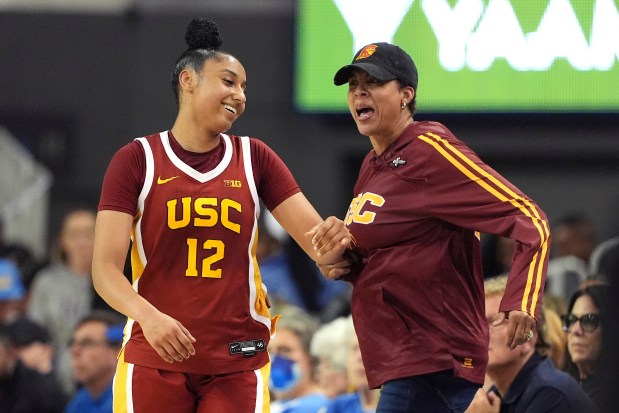 JuJu Watkins reacts to former USC player Cheryl Miller after scoring during the second half on March 1, 2025, in Los Angeles. (AP Photo/Mark J. Terrill)