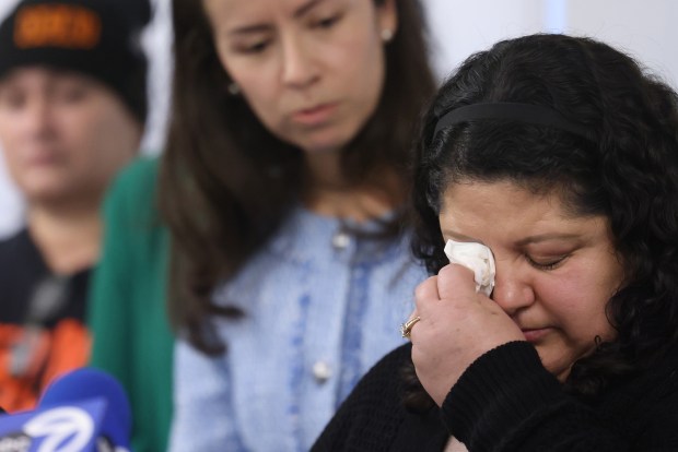 Yolanda Orozco, wife of Abel Orozco, wipes tears as she speaks during a press conference at the National Immigrant Justice Center on March 17, 2025. (Antonio Perez/Chicago Tribune)