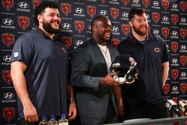 New Bears, from left, Jonah Jackson, Grady Jarrett and Joe Thuney are officially announced during a news conference at Halas Hall on March 12, 2025. (Audrey Richardson/Chicago Tribune)