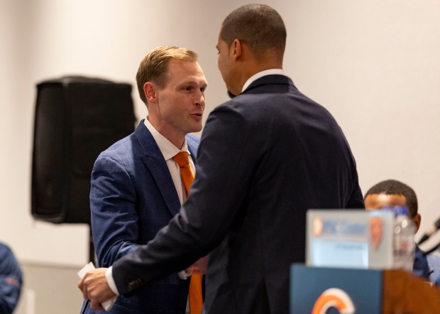 Ben Johnson, left, hugs general manager Ryan Poles after being introduced as the new Bears coach Jan. 22, 2025, at Halas Hall. (Brian Cassella/Chicago Tribune)