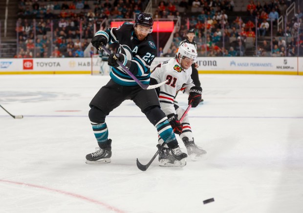 The Sharks' Barclay Goodrow battles the Blackhawks' Frank Nazar (91) during the third period Thursday, March 13, 2025, in San Jose, Calif. (Shae Hammond/Bay Area News Group)